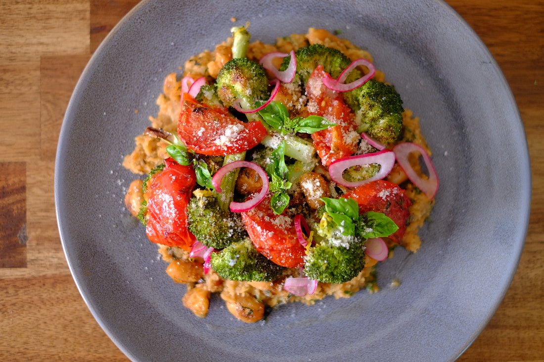 Charred broccoli w/ balsamic roast tomato and confit garlic butterbeans